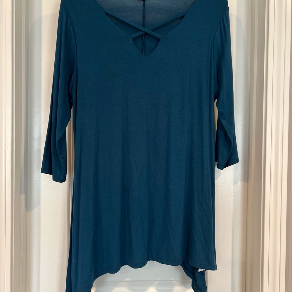 Teal “ shark bite” style bottom with cross detail at neckline 1x